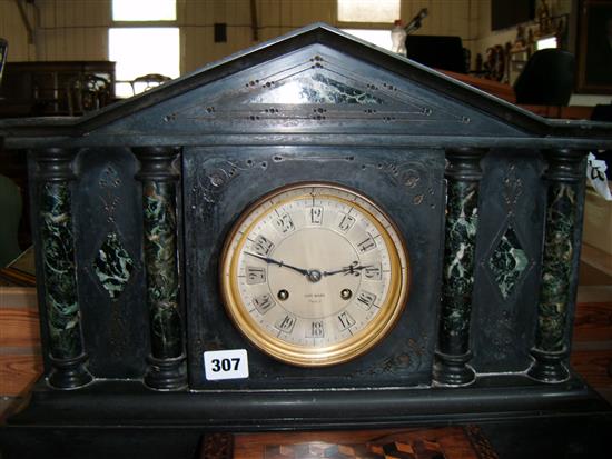 Henri Mac, Paris. A 19th century French black slate and green marble mantel clock, damaged